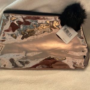 Gold and black pom pom bag